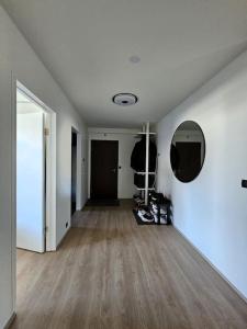 an empty room with white walls and a wooden floor at Apartment near Reykjavik's heart in Reykjavík