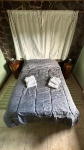 Una cama o camas en una habitación de KaiKen Lauquen