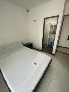En eller flere senge i et værelse på Hotel Milenium