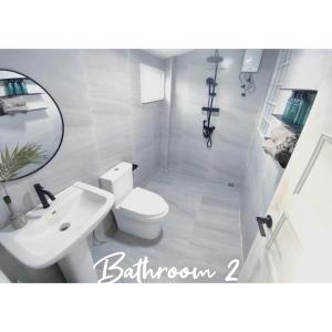 a bathroom with a white toilet and a sink at 3BR Villa, Bangrak Beach, Koh Samui in Koh Samui 