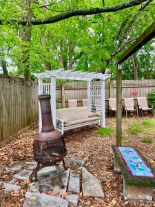 a fireplace in a backyard with a gazebo at Family Friendly Downtown Home - Private Yard & Grill - Location, Location, Location! in Athens
