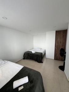 Postel nebo postele na pokoji v ubytování Duplex La Mesa Cundinamarca