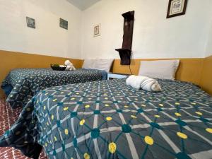 Un ou plusieurs lits dans un hébergement de l'établissement Casa del viajero Antigua
