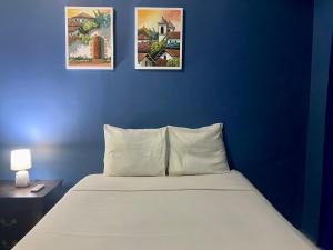 Postel nebo postele na pokoji v ubytování Horus Suite Apartamento