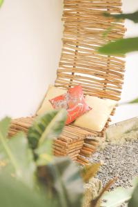 a pile of baskets sitting on top of a table at The Living Room Siargao in General Luna