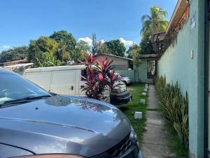 a car parked in front of a house at Horus Suite Apartamento in San Pedro Sula