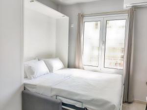 Postel nebo postele na pokoji v ubytování Pretty Petitie Fully Equipped City Center Studio