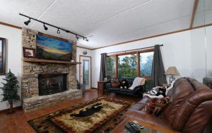 a living room with a couch and a fireplace at Memory Maker - GB in Gatlinburg