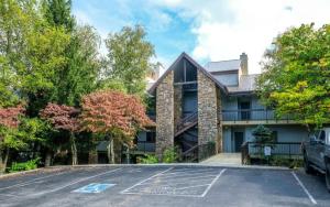 a house with a parking lot in front of it at Memory Maker - GB in Gatlinburg