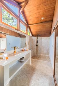 a bathroom with a sink and a shower at BaraJade Villas in Uluwatu