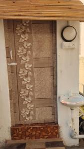 a bathroom with mushrooms on the wall next to a sink at Starlit premium camps in Mahabalipuram