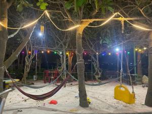 a park with a hammock and trees at night at Hoa Bien Motel in Ly Son