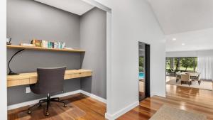 a home office with a desk and a chair at Villa Tallawanta in Pokolbin +13 photos