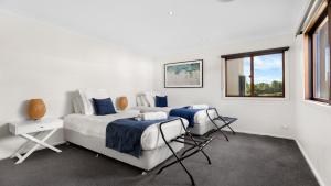 Ένα ή περισσότερα κρεβάτια σε δωμάτιο στο Peppertree Ponds