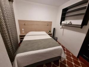 Casa Capirucho tesisinde bir odada yatak veya yataklar
