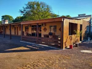 a small building with a fence in front of it at Hotel Alvorada in Alegrete +43 photos