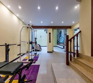 a fitness room with a gym with tread machines at Annie Dianchi Lake Villas in Kunming