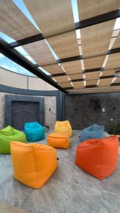 a group ofools sitting on the floor in a room at Dahab villa in Al Rama