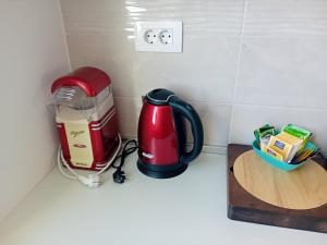 Příslušenství pro přípravu čaje a kávy v ubytování Kalista