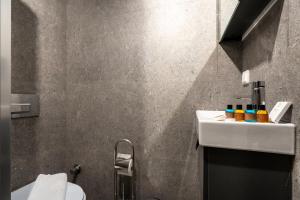 a bathroom with a sink and a toilet at Sayeban Gold Hotel in Istanbul