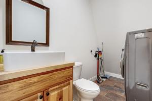 a bathroom with a white sink and a toilet at Valley Vista Vacay in Littleton +16 photos