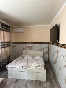 A bed or beds in a room at У Розы