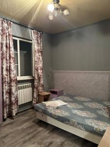 A bed or beds in a room at У Розы