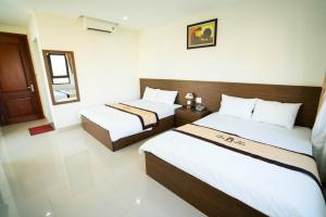 Voodi või voodid majutusasutuse Thăng Long 2 Hotel FLC toas