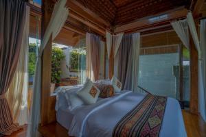 Postel nebo postele na pokoji v ubytování Gdas Bali Health and Wellness Resort - Adult Only