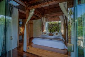 Postel nebo postele na pokoji v ubytování Gdas Bali Health and Wellness Resort - Adult Only
