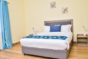 Postel nebo postele na pokoji v ubytování Kongoni House + 37 fotografií