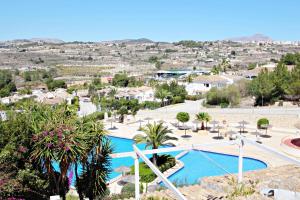 arial view of a resort with a swimming pool at Palomita - cosy bungalow with stunning views in Moraira in Rada de Moraira
