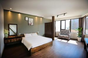 Postel nebo postele na pokoji v ubytování River Park Hotel Dalat