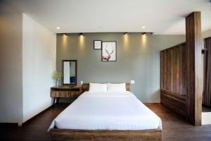 Postel nebo postele na pokoji v ubytování River Park Hotel Dalat