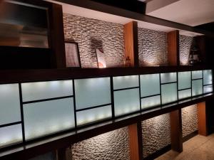 a wall of glass panels in a lobby at Hwamyeong Sky Hotel in Busan