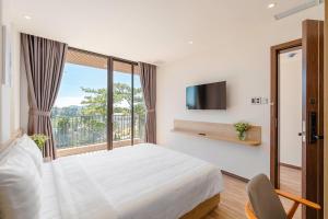 Postel nebo postele na pokoji v ubytování River Park Hotel Dalat