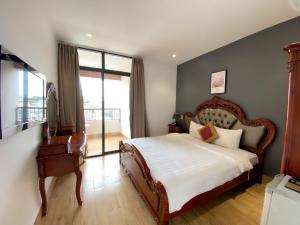 Postel nebo postele na pokoji v ubytování River Park Hotel Dalat