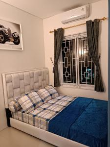 Кровать или кровати в номере Family Homestay