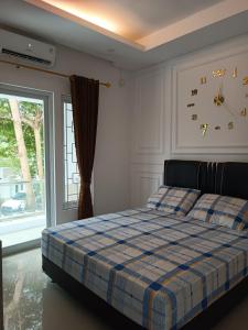 Кровать или кровати в номере Family Homestay