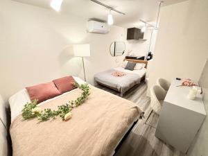 リリハウス笹塚 tesisinde bir odada yatak veya yataklar