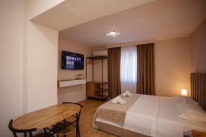 Postel nebo postele na pokoji v ubytování City Center Studio Apartments
