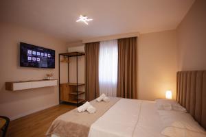 Postel nebo postele na pokoji v ubytování City Center Studio Apartments