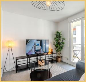 TV a/nebo společenská místnost v ubytování Chez Nico I T3 I Ville la Grand