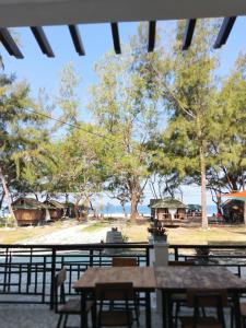a view of the beach from a picnic table at Villa Loreta Beach Resort in Zambales