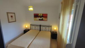 Katil atau katil-katil dalam bilik di Loukas Apartment