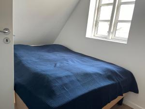 Postel nebo postele na pokoji v ubytování Skagen City Apartments