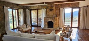 a living room with a couch and a fireplace at Villa Toscana in Gokceada Town