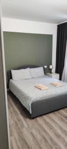 A bed or beds in a room at Navigli-Darsena In the Heart of the City