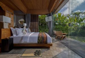 Postel nebo postele na pokoji v ubytování Gdas Bali Health and Wellness Resort - Adult Only