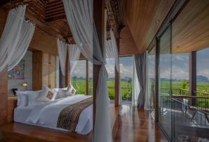 Postel nebo postele na pokoji v ubytování Gdas Bali Health and Wellness Resort - Adult Only